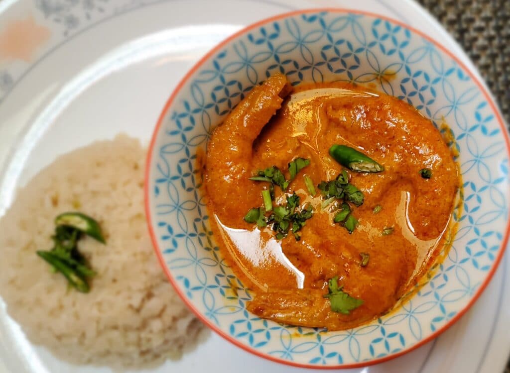Keto Coconut Shrimp Curry - in a bowl with cauliflower rice