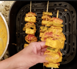 Thread paneer tikka with skewers