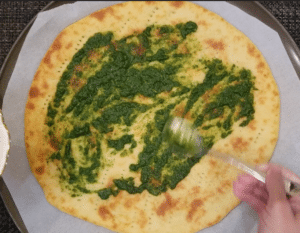 coriander mint sauce on pizza base